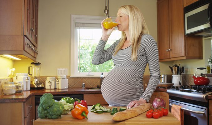 Pregnant Woman Drinking Juice